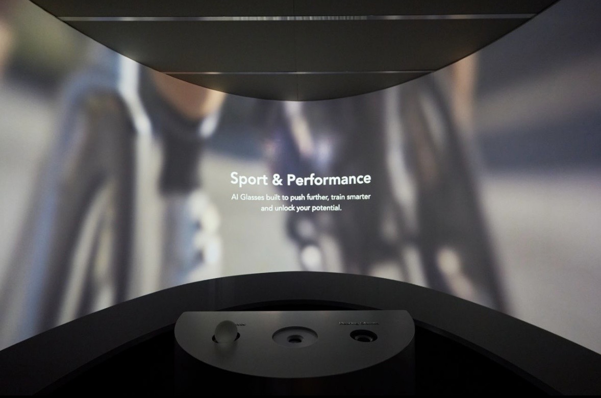 A room-scale projection reading Sport and Performance above a console with three sensor wells